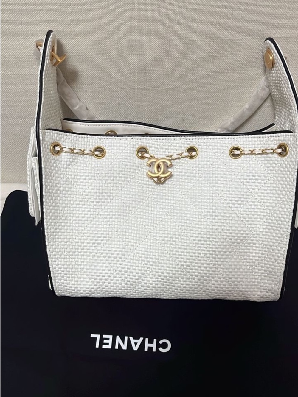 White leather bag with gold accents